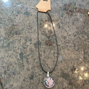 Pretty butterfly pendant on black necklace